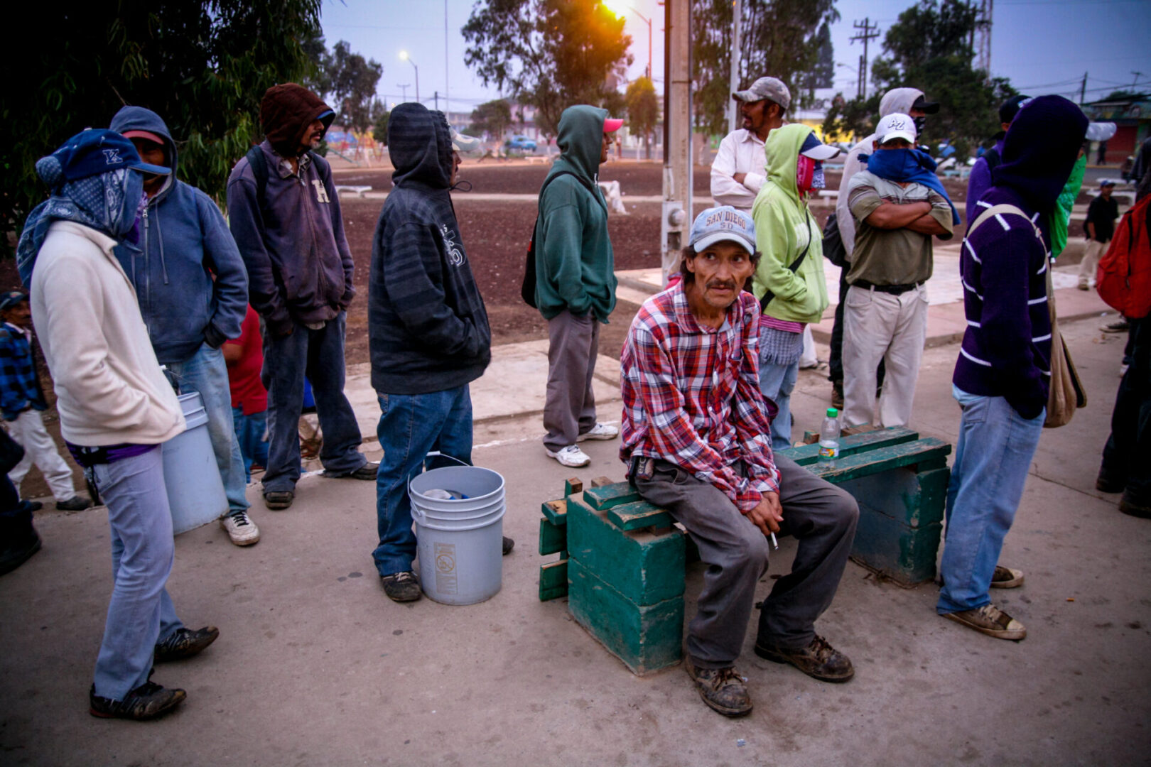 San Quintin, Baja California, Mexico, July 21 - Some seasonal farm workers wait until dawn for owners of the strawberry and flower fields to come and offer work in San Quintin, north of the Baja California peninsula.